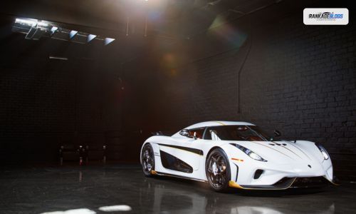 Luxury car in an auto glass repair workshop receiving windshield inspection